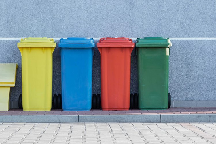 four colorful trashcans